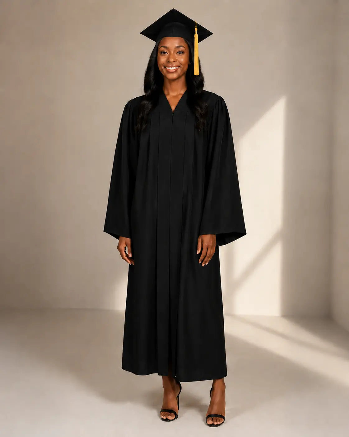 Black female graduate wearing the official black cap and gown