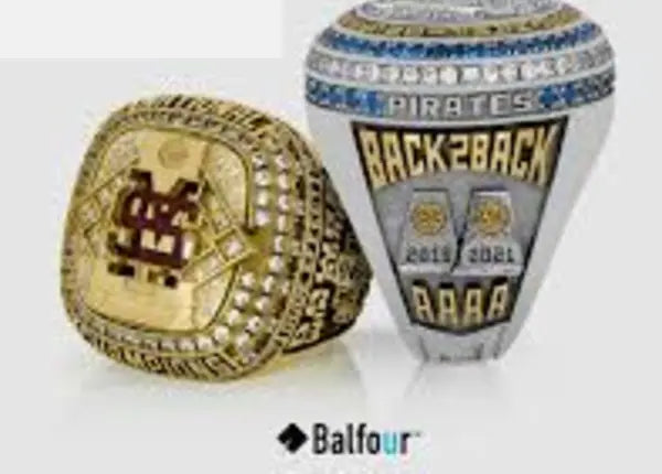 Close-up of two custom Balfour championship rings
