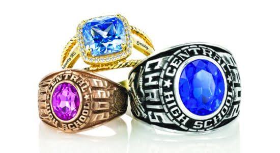 Three customizable high-school class rings in gold, silver and rose-gold finishes